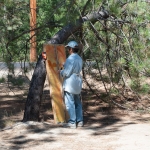 student Claudia painting outside